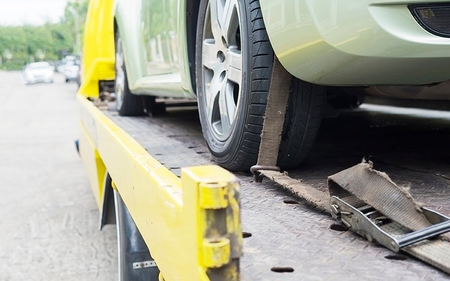 car-transporter-breakdown-lorry-working-using-locked-belt-transport-other-green-car